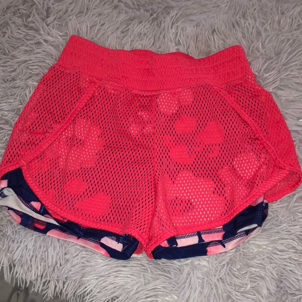 Pink Shorts with blue flower spandex underneath